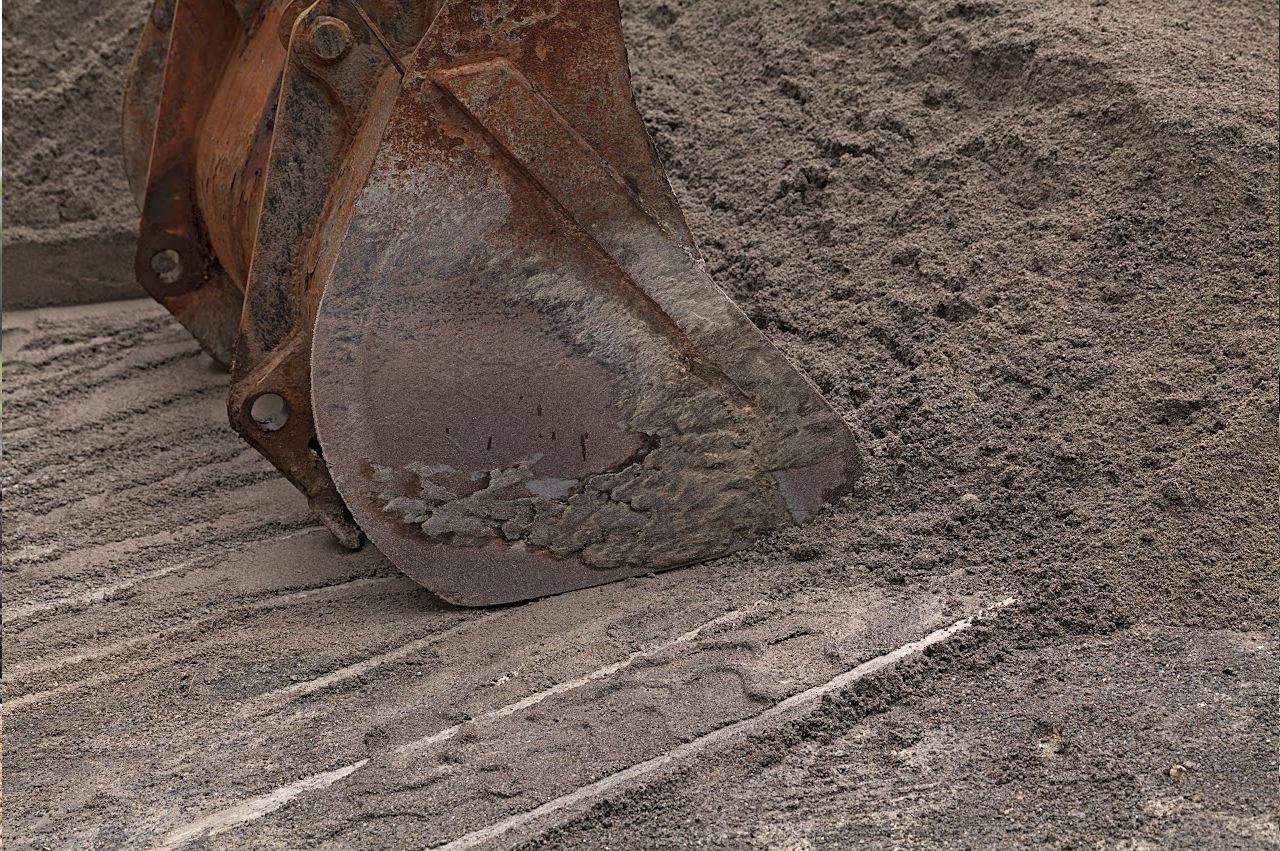 Image of an excavator digging dirt