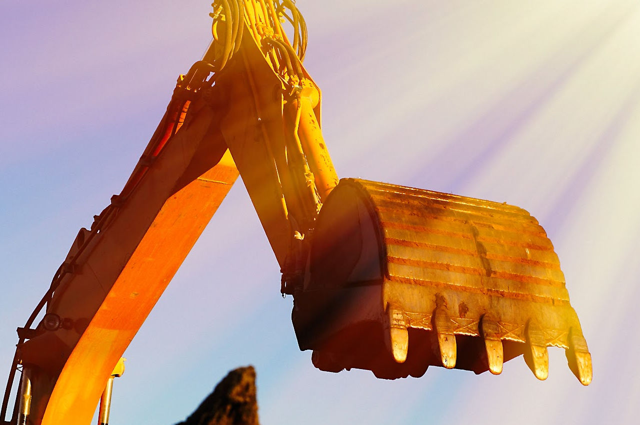 Image of an excavator working on a septic tank