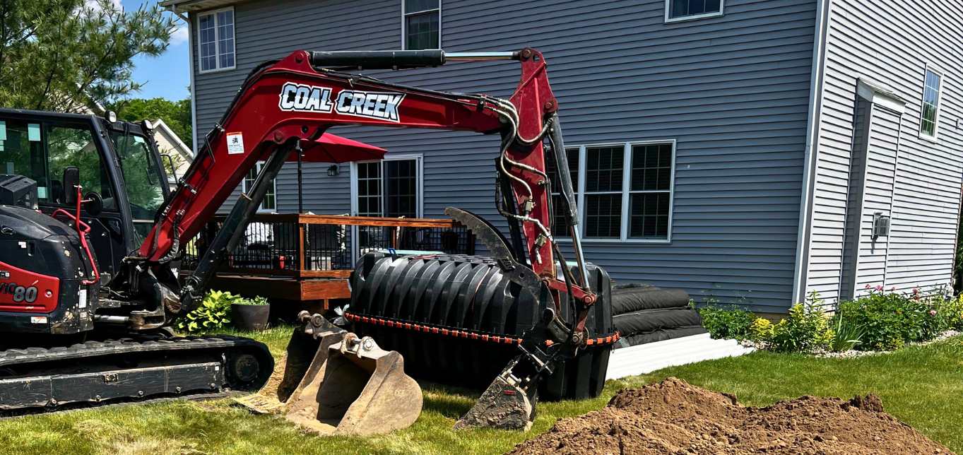 Image of Coal Creek Excavating Installing Septic Tank Image of Coal Creek Excavating Installing Septic Tank