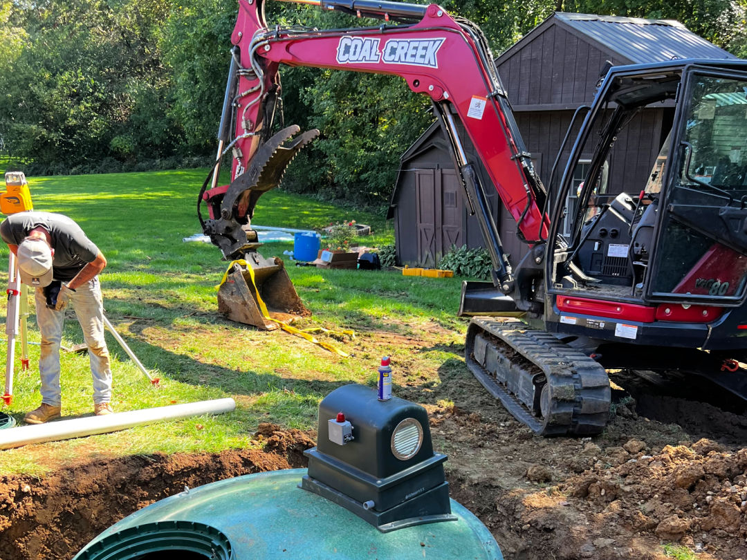 Image of Coal Creek installing a Hydro-Action septic tank