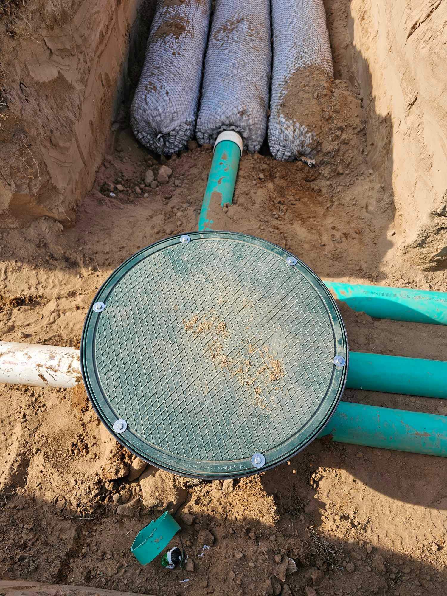 Gaddy, Spring Lake Close-up of a septic tank lid and piping