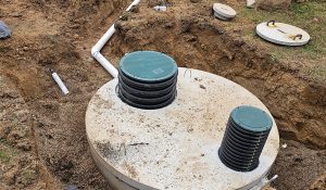 instalation Septic tank being installed in a trench