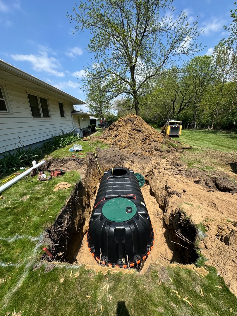 IMG_7085 Septic tank sits in a deep, grassy trench
