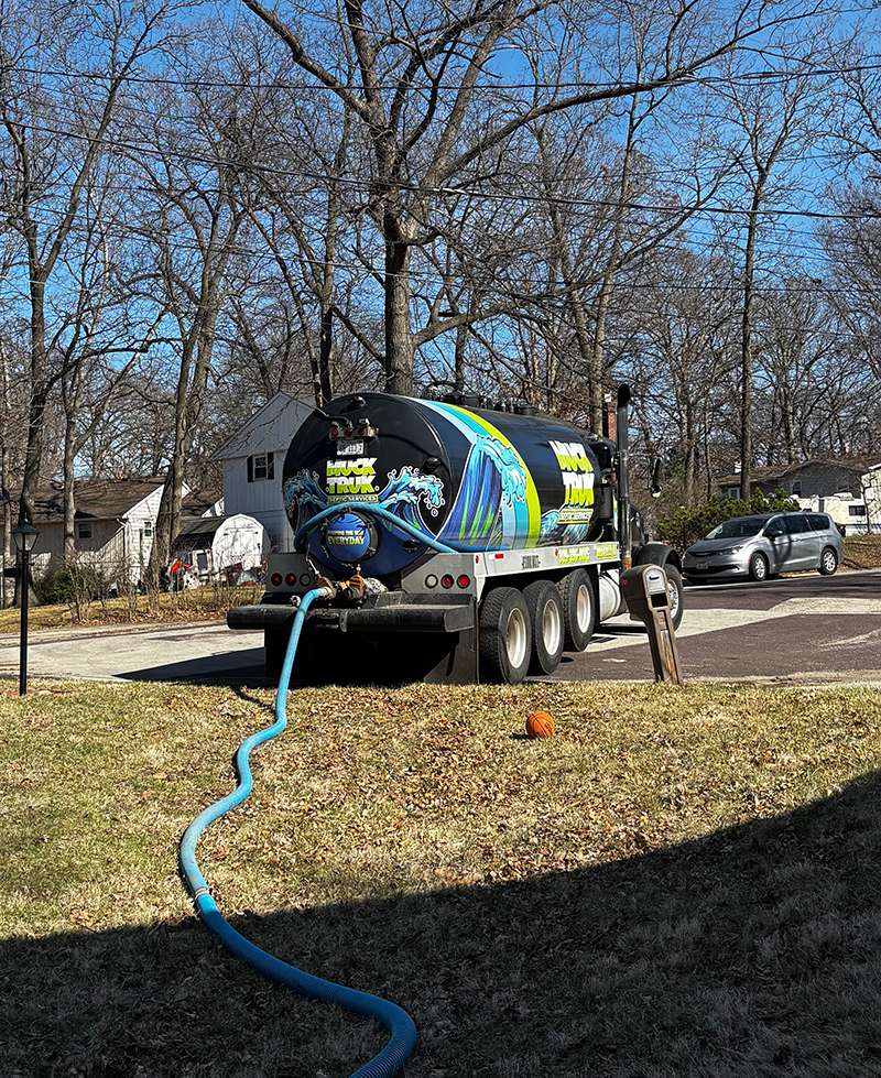 Septic services truck with hose