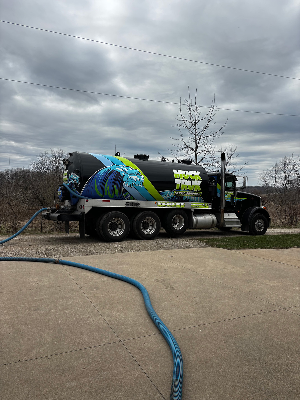 Septic services truck with hose 2