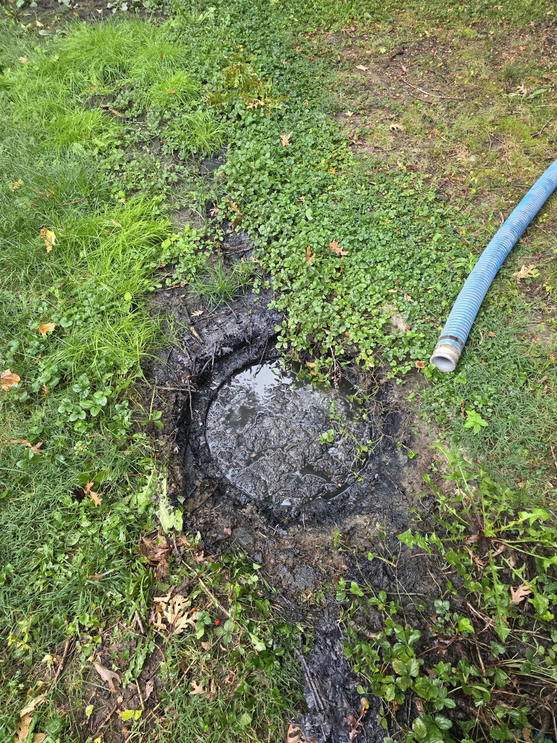 Septic tank installation beside a building