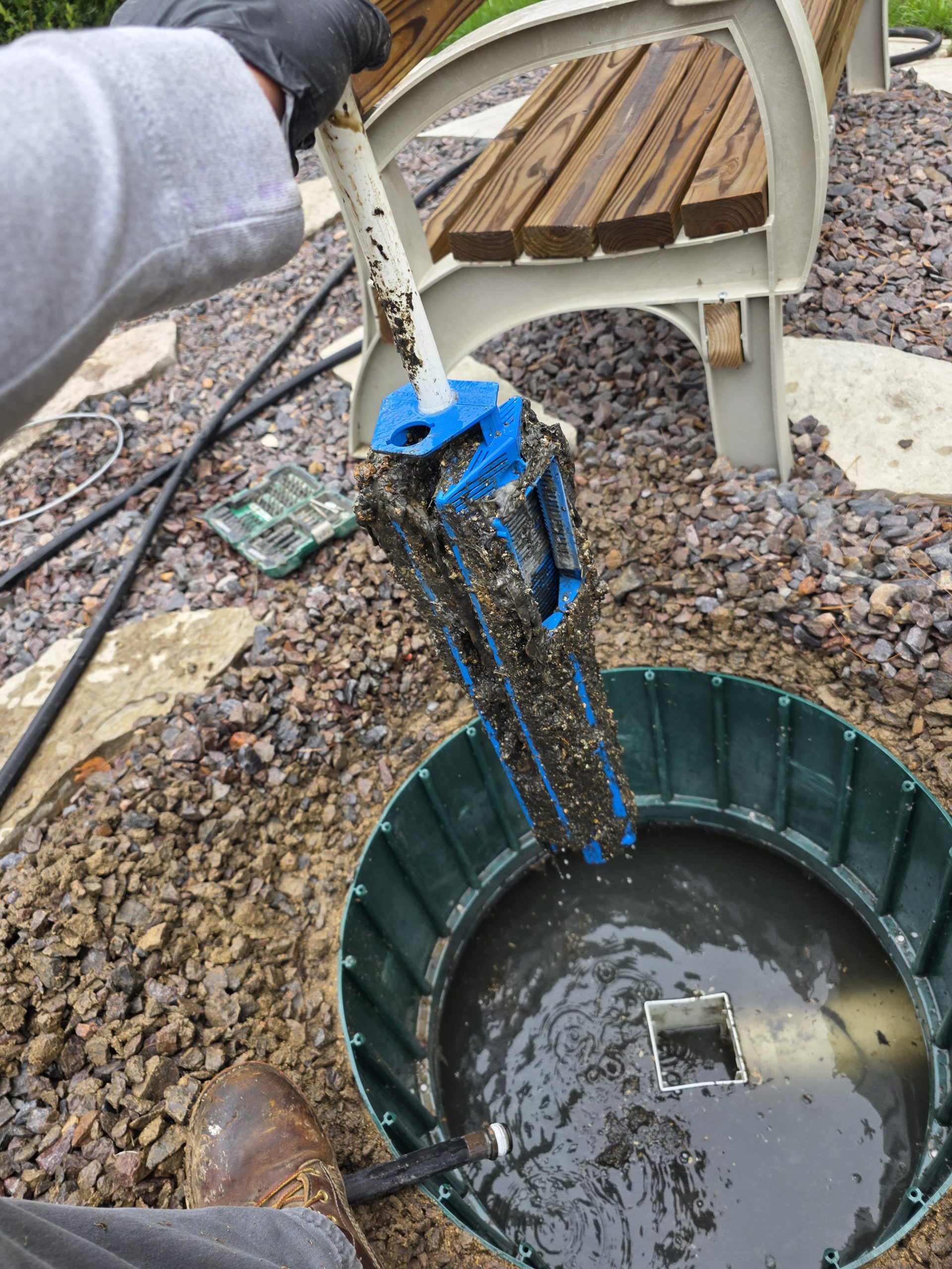 Excavator unloads dirt into a dump truck
