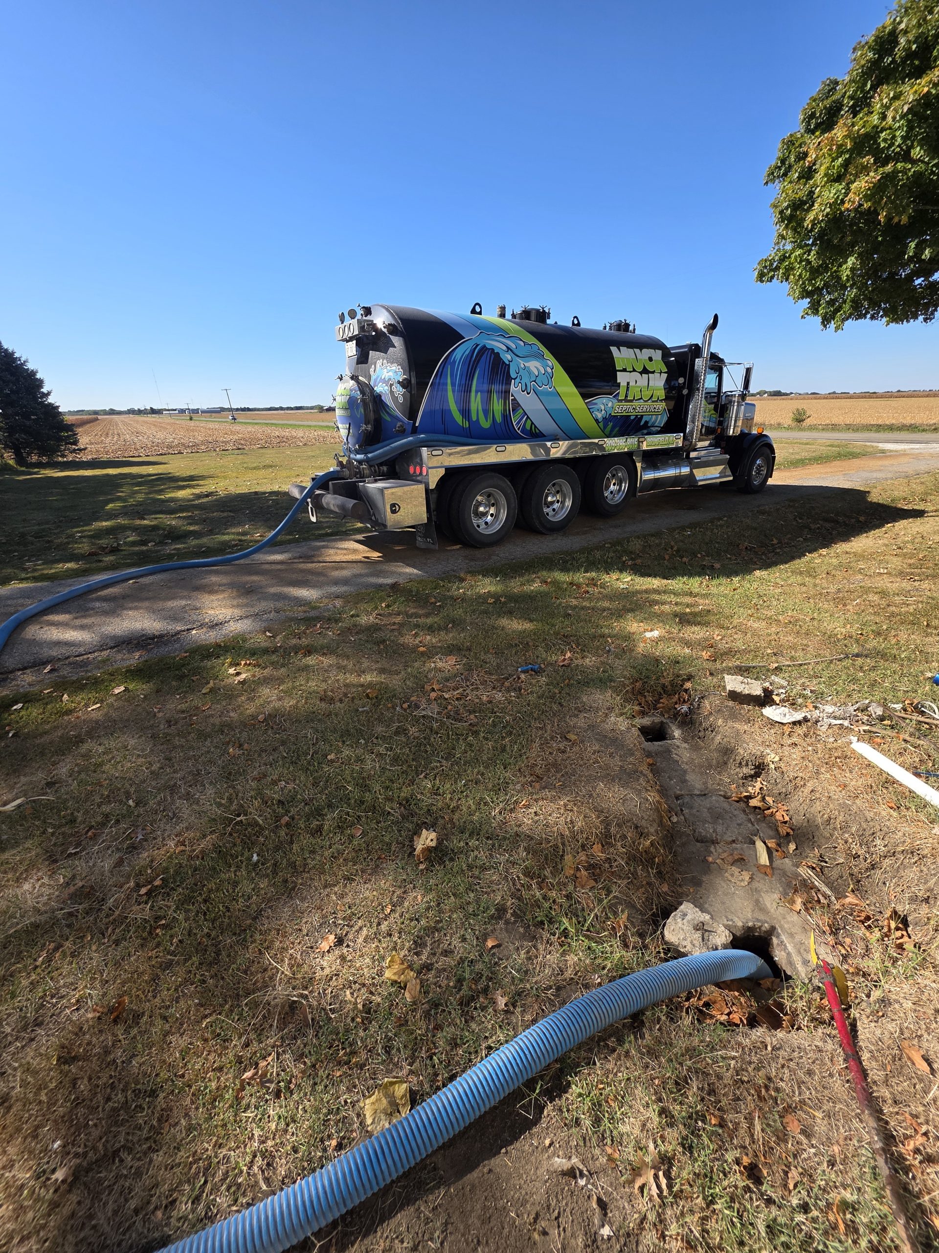 20251009_103852 Septic services truck with hose